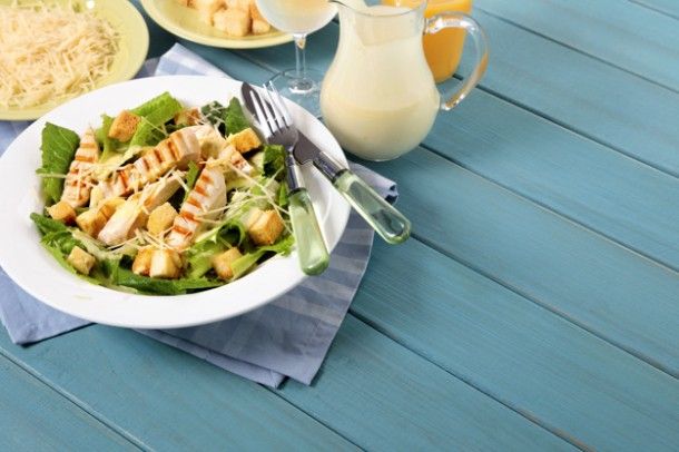 chicken-caesar-salad-on-picnic-table_1147-64