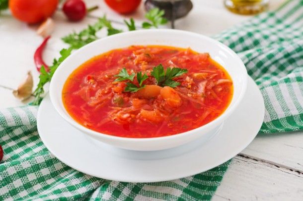 traditional-ukrainian-russian-vegetable-borscht-on-the-white-wooden-background_2829-552